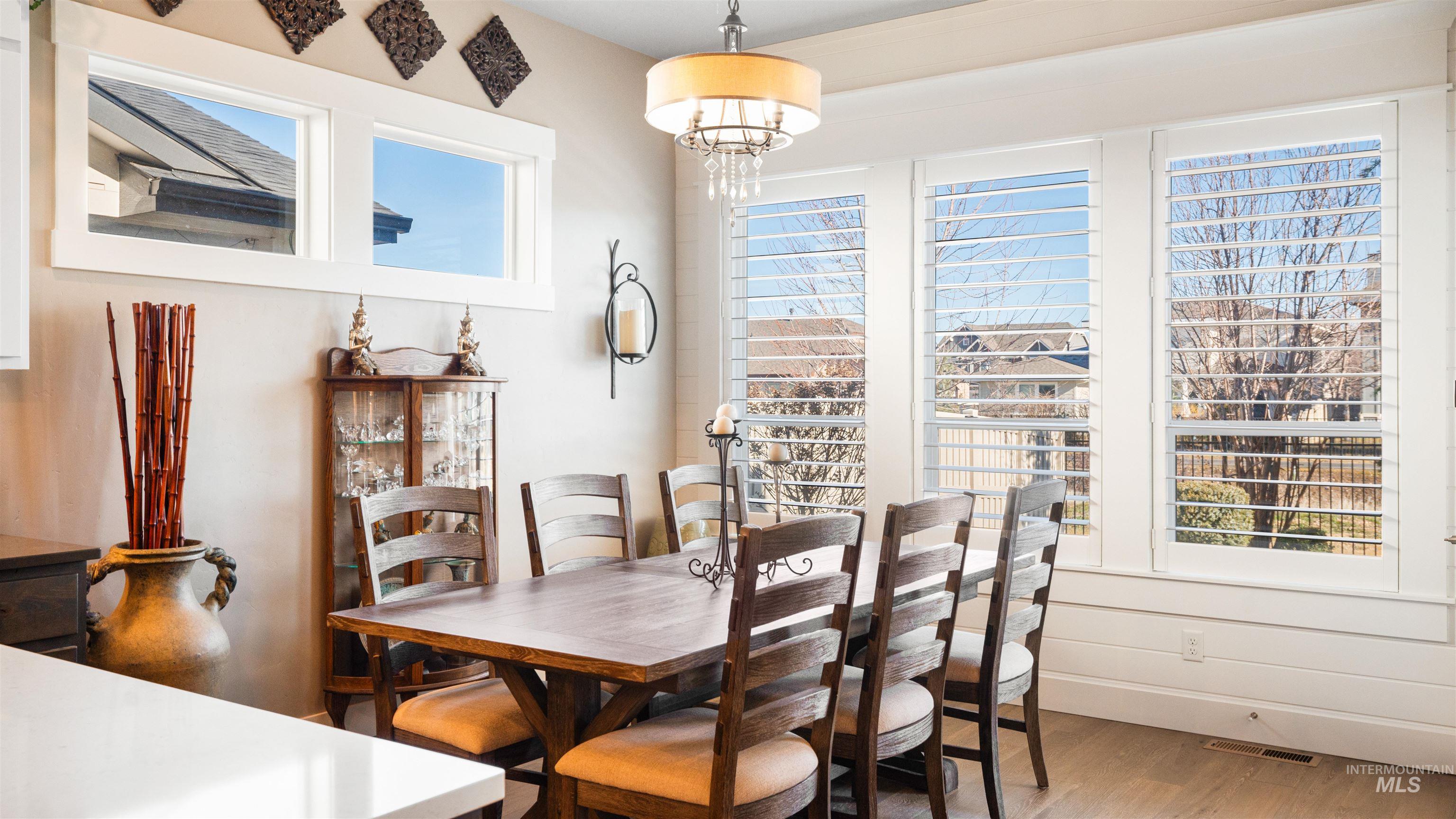 4676 South Abbot Meridian, ID 83642 - Photo 29 of 49 Dining area with wood finished floors and suspended lighting