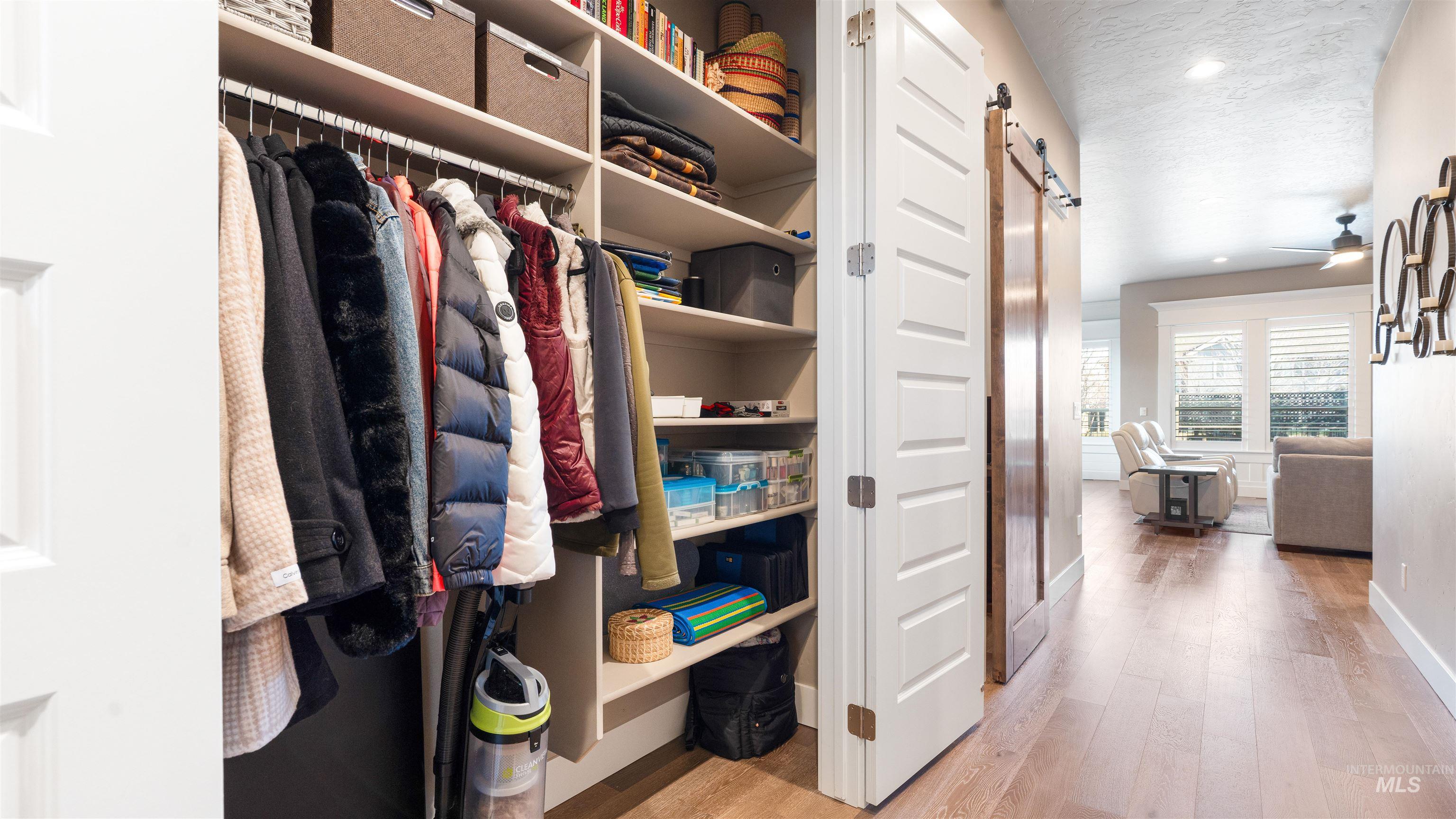 4676 South Abbot Meridian, ID 83642 - Photo 44 of 49 Walk in closet featuring a barn door and light wood-style floors