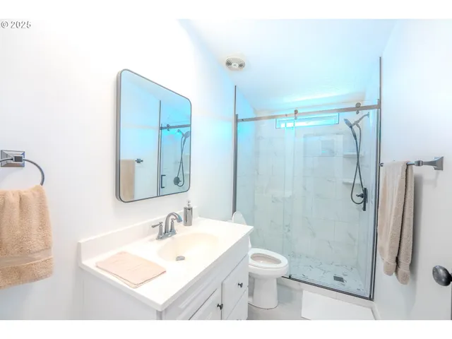 a kitchen with a sink appliances and cabinets
