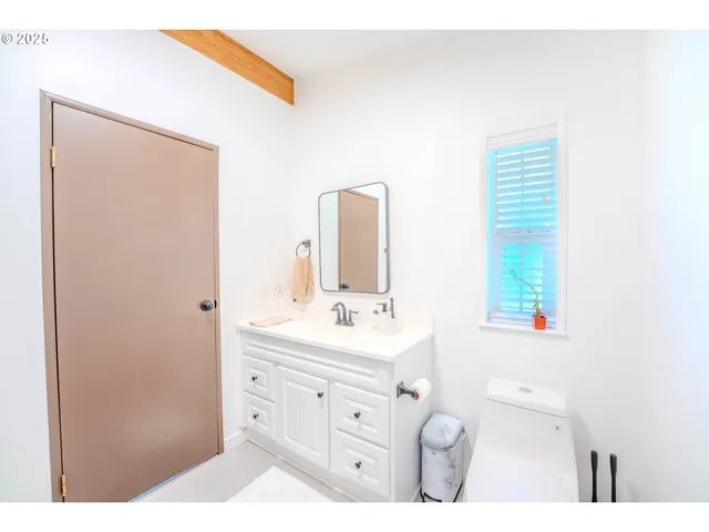 a bedroom with a bed and a television