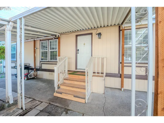 a view of a house with wooden floor and a potted plant