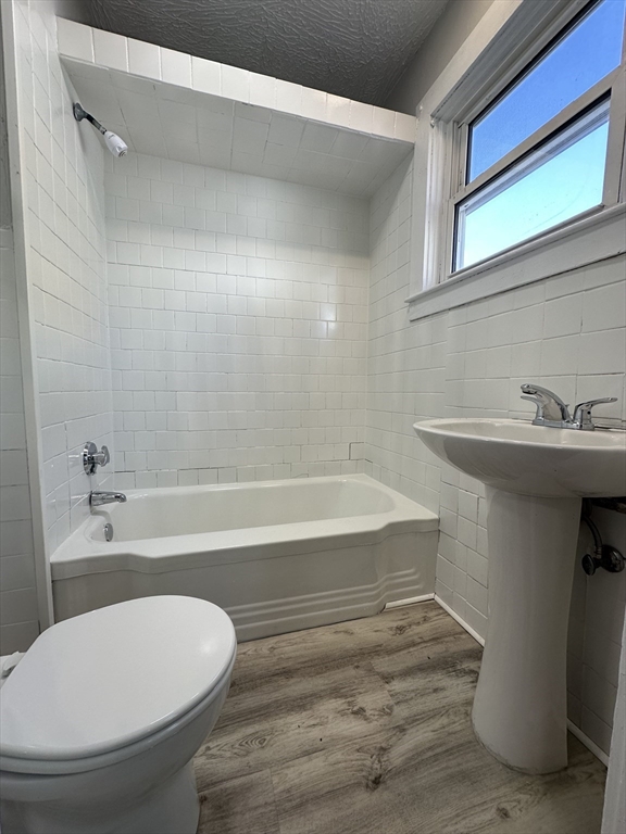 66 Lyon Street, Unit 1 Fall River, MA 02721 - Photo 10 of 11 a bathroom with a sink and a toilet