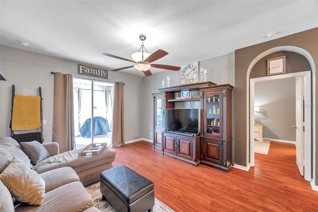 4506 Mapletree Loop Wesley Chapel, FL 33544 - Photo 21 of 60 Primary bedroom off Family room