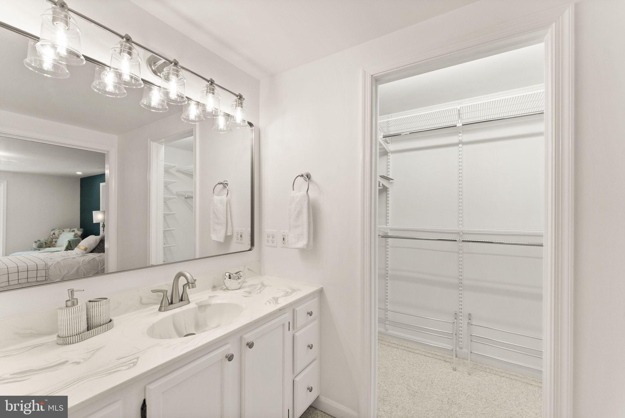 38620 Lime Kiln Road Leesburg, VA 20175 - Photo 35 of 87 a bathroom with a double vanity sink mirror and shower