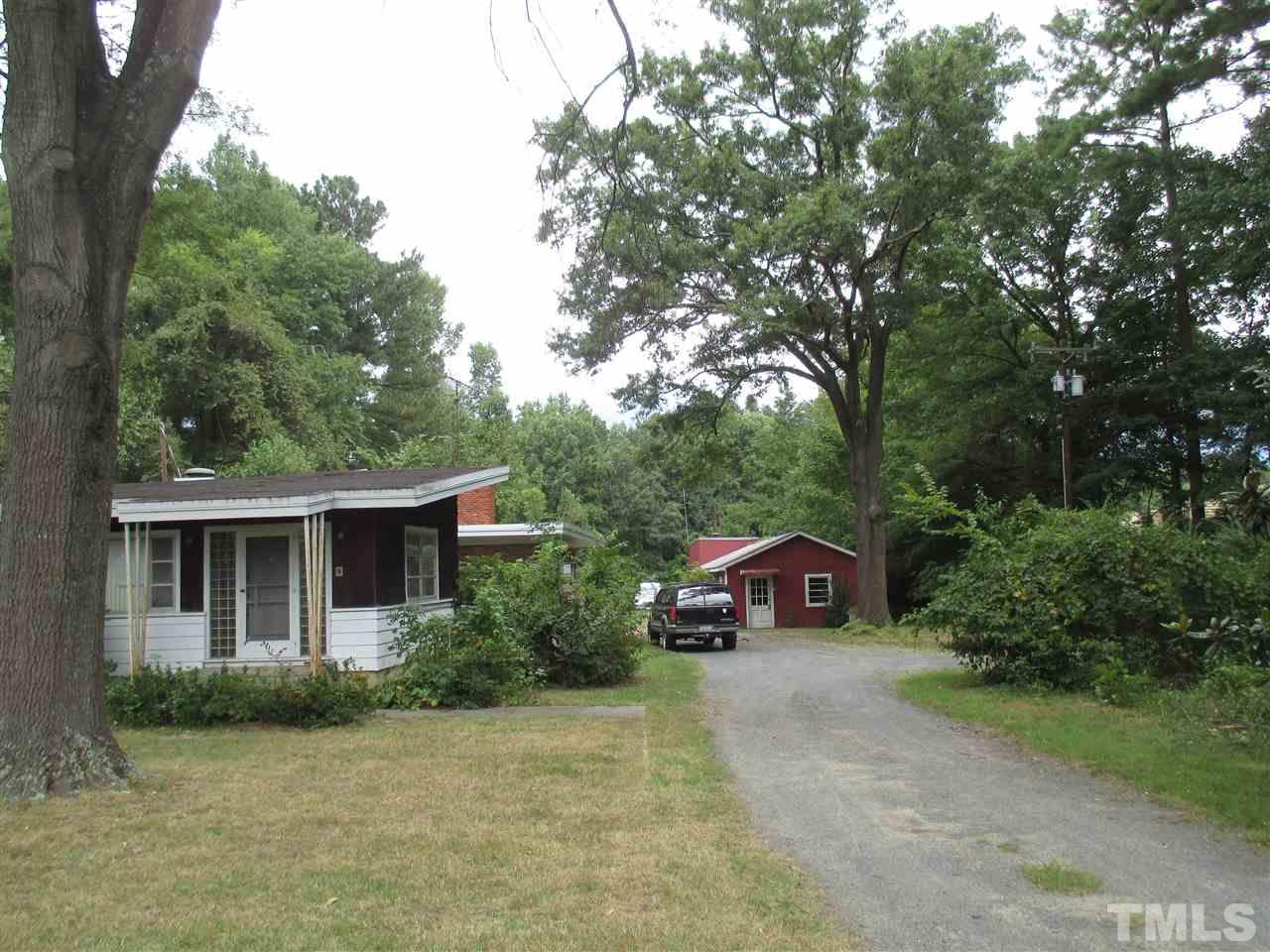 712 Horton Road Durham, NC 27704 - Photo 2 of 6 a front view of a house with a yard and garage