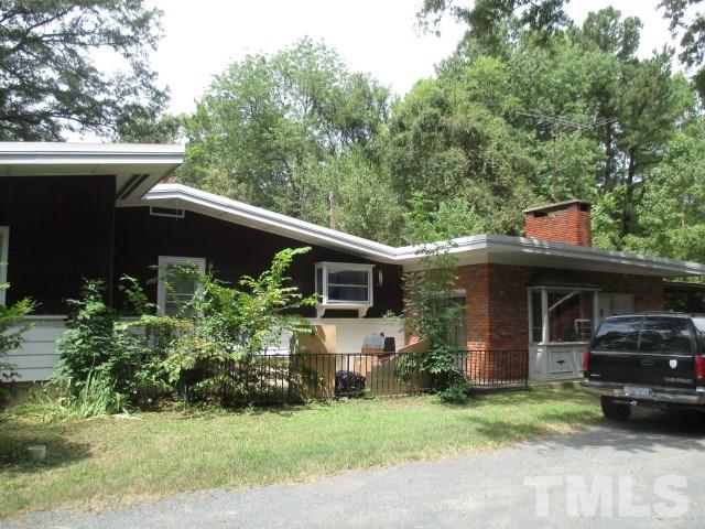 712 Horton Road Durham, NC 27704 - Photo 3 of 6 a view of a house with a garden