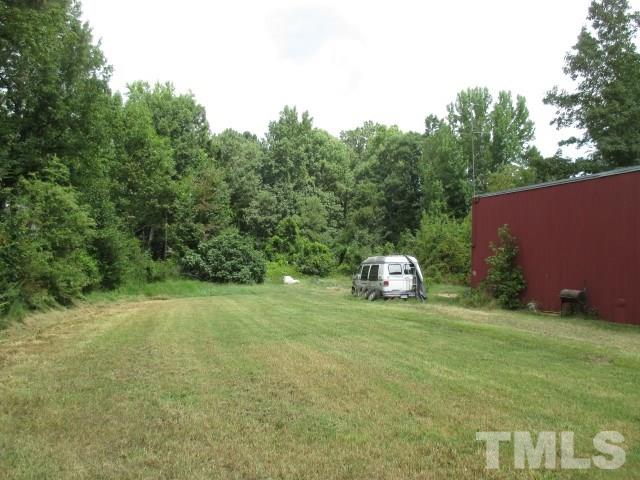 712 Horton Road Durham, NC 27704 - Photo 5 of 6 a view of a big yard with a house