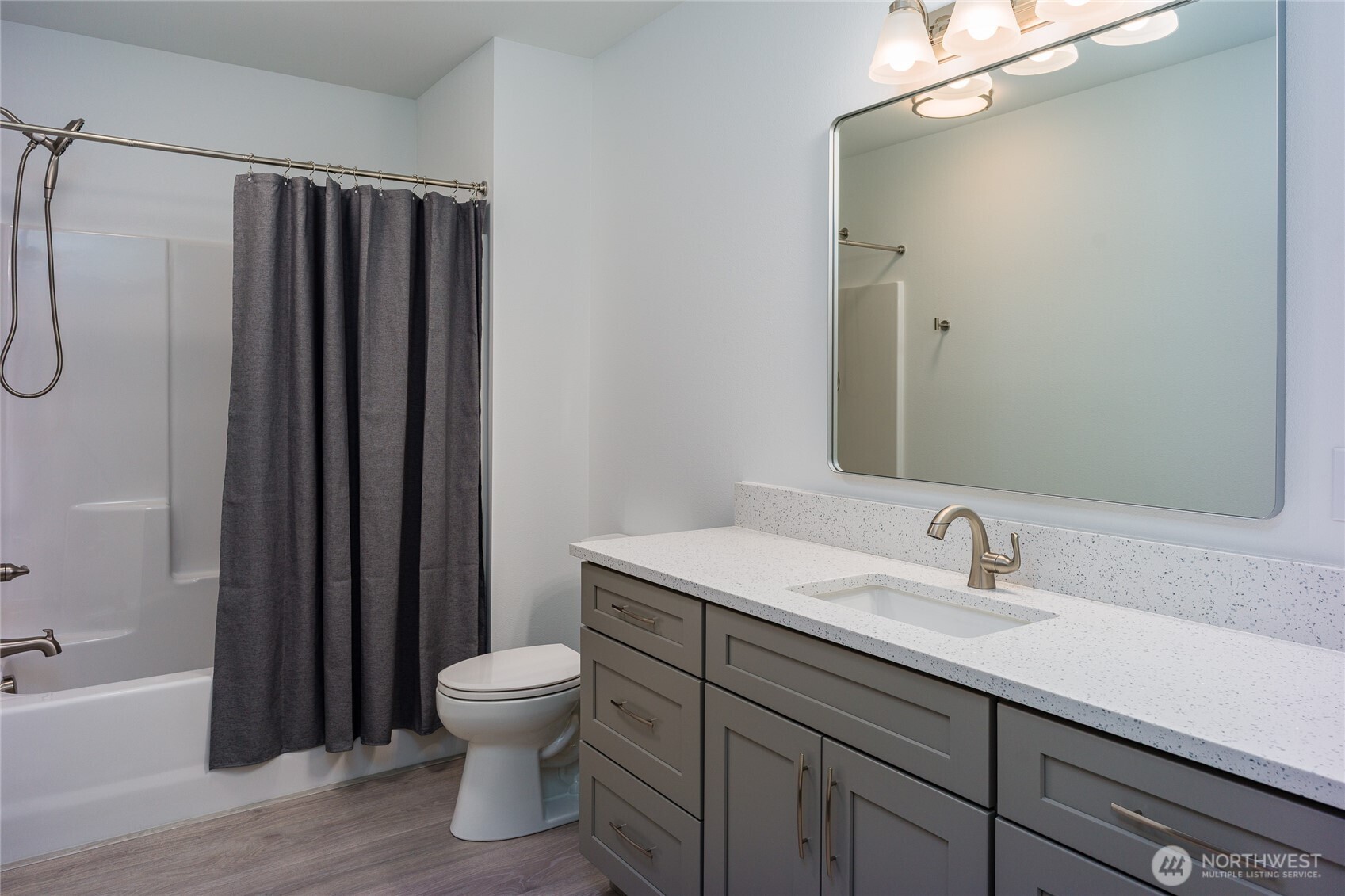 623 Morris Street, Unit E2 La Conner, WA 98257 - Photo 14 of 29 a bathroom with a sink a toilet and shower