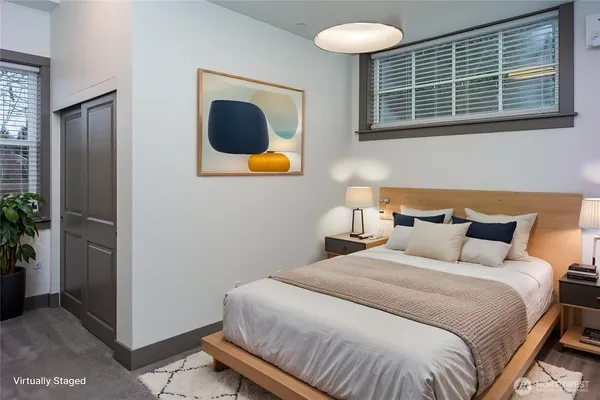 a bedroom with bed and window