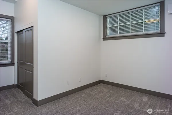 a view of empty room with windows