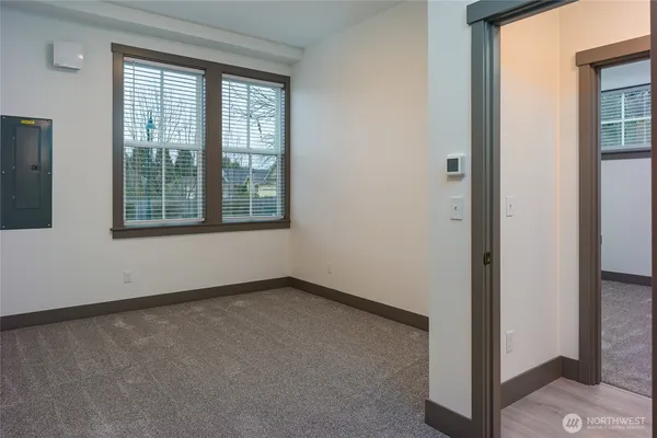 a view of an empty room with a window