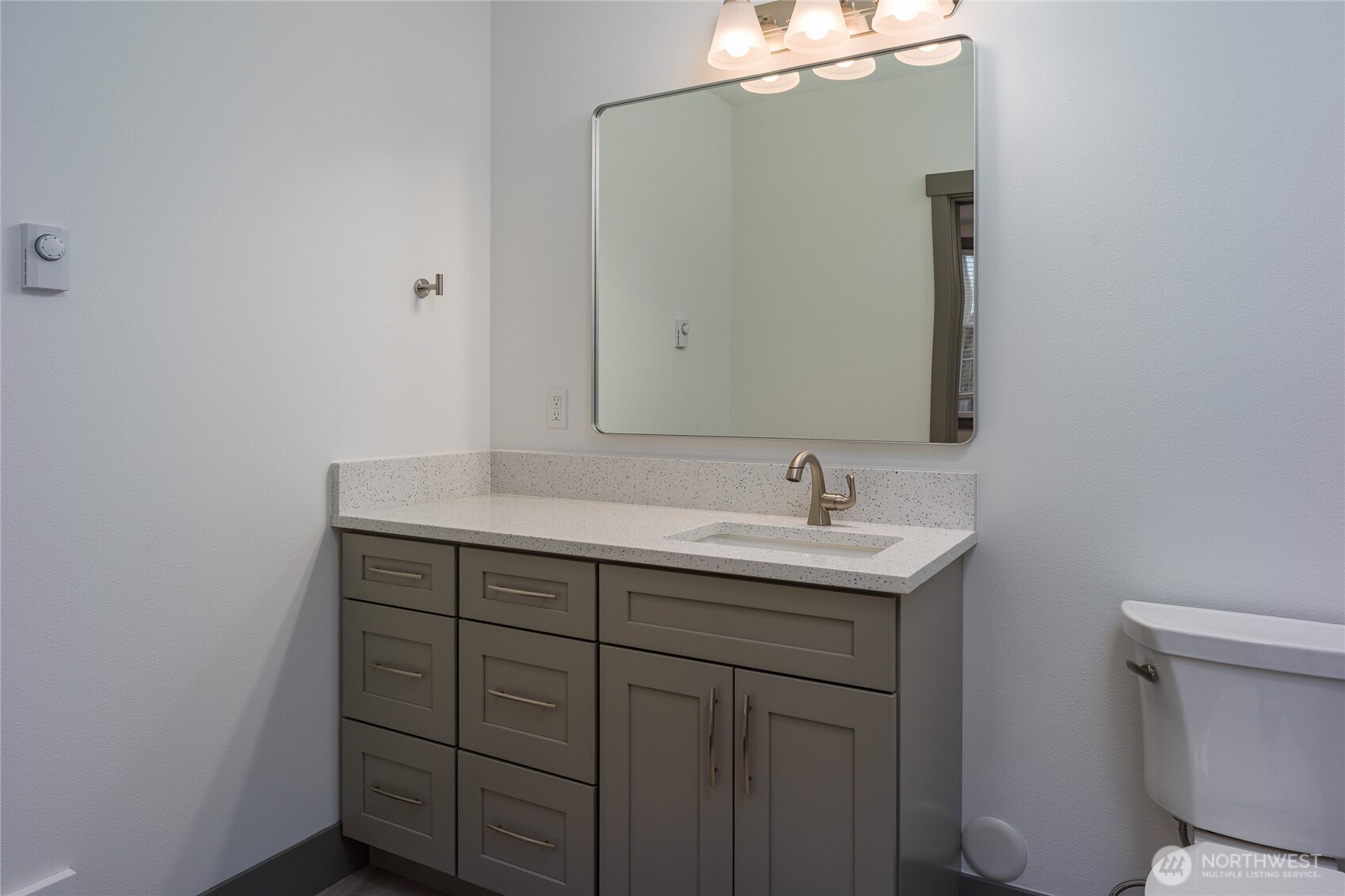 623 Morris Street, Unit E2 La Conner, WA 98257 - Photo 21 of 29 a bathroom with a sink and a toilet
