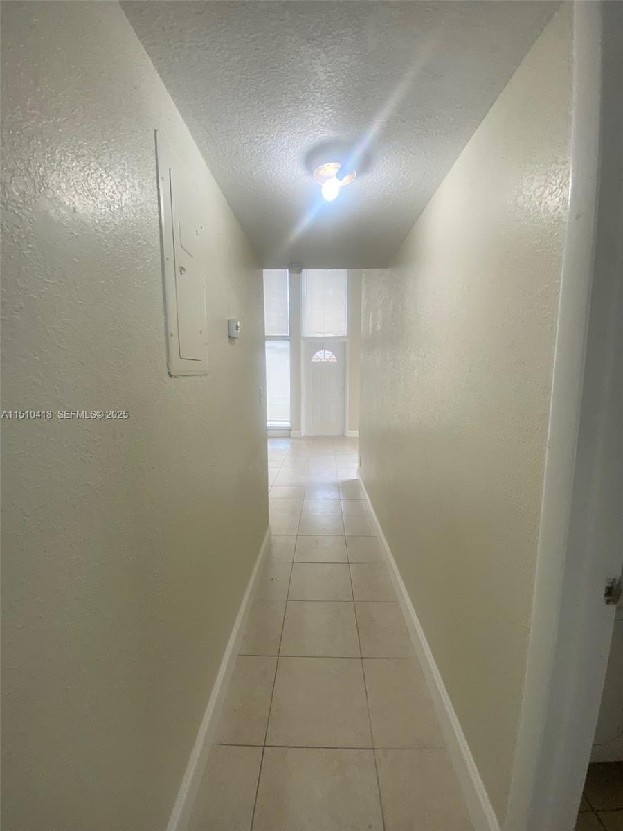 7351 West Sunrise Boulevard, Unit 7351 Plantation, FL 33322 - Photo 13 of 44 a view of a hallway