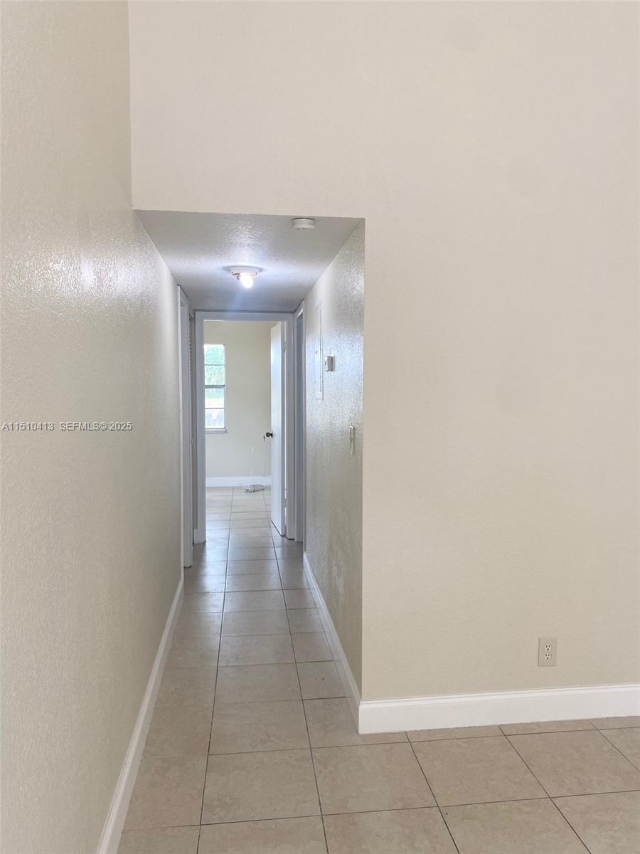 7351 West Sunrise Boulevard, Unit 7351 Plantation, FL 33322 - Photo 14 of 44 a view of a hallway
