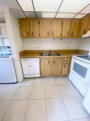 a kitchen with a stove and a sink