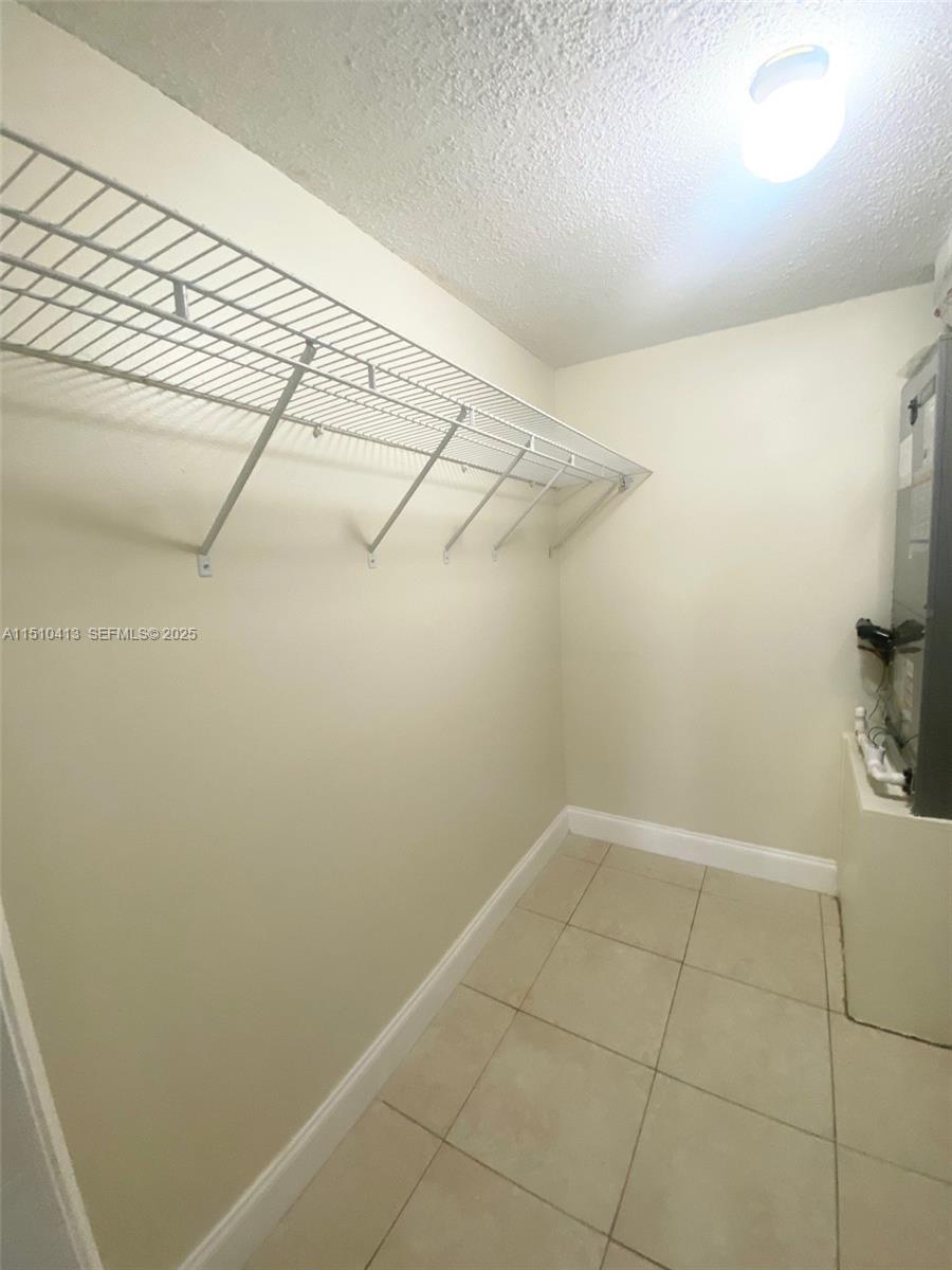 7351 West Sunrise Boulevard, Unit 7351 Plantation, FL 33322 - Photo 28 of 44 a view of a room with racks on the wall