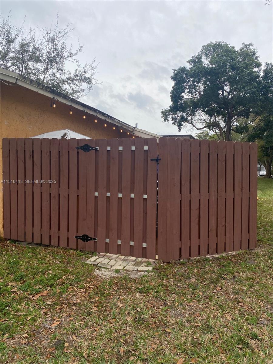 7351 West Sunrise Boulevard, Unit 7351 Plantation, FL 33322 - Photo 37 of 44 a view of wooden fence