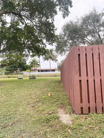 a view of outdoor space with trees all around