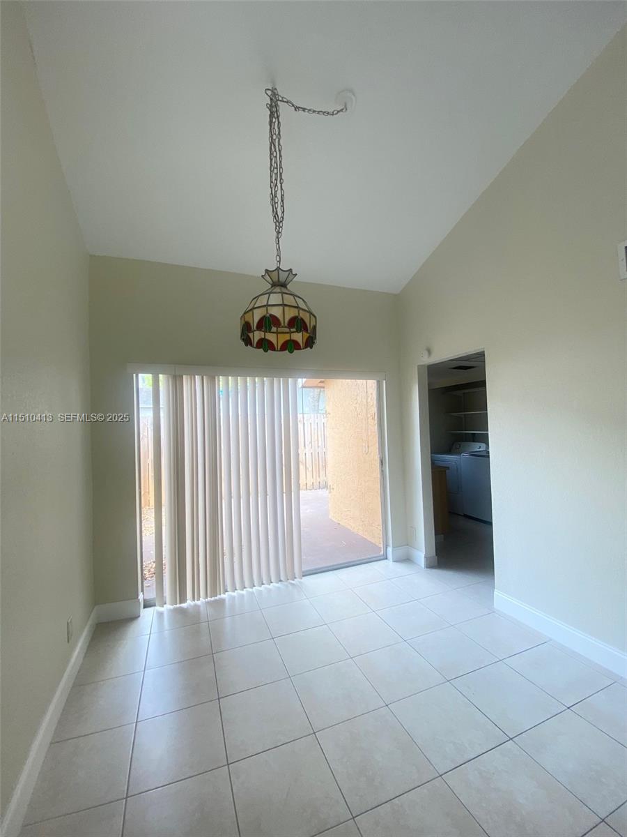 7351 West Sunrise Boulevard, Unit 7351 Plantation, FL 33322 - Photo 8 of 44 a view of a livingroom with a chandelier