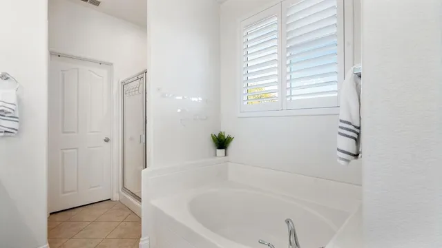 a white bath tub sitting in a bathroom