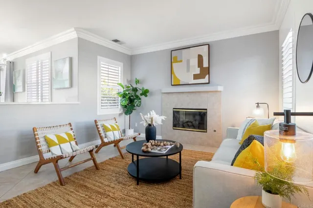 a living room with furniture and a fireplace
