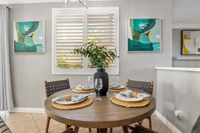 a dining room with furniture and window