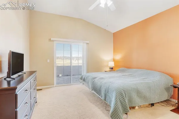 a view of room with cabinet and flat screen tv