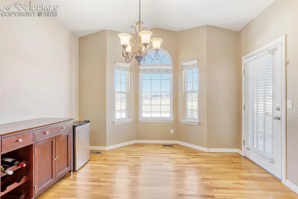 a view of a livingroom with furniture and a flat screen tv