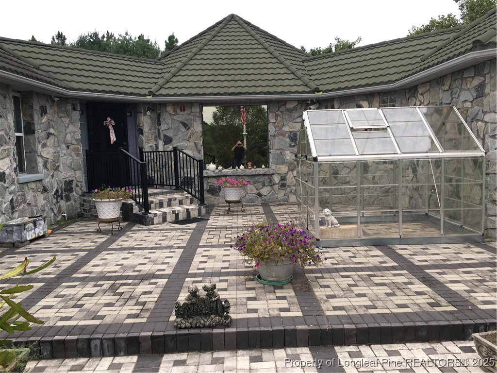 a front view of a house with garden