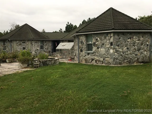 a view of a house with a garden