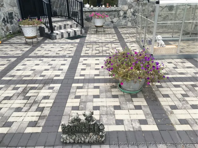 a view of a backyard with sitting area