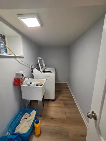 a view of a room with wooden floor