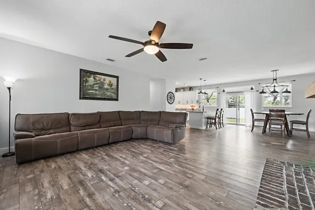 a view of a garage with a flat screen tv and a couch