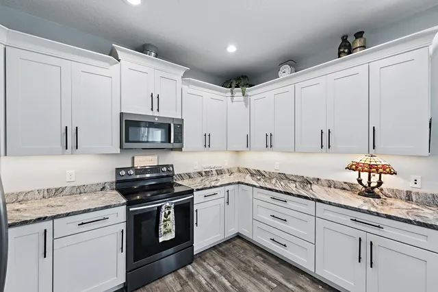 a view of a swimming pool with an outdoor seating and a garden