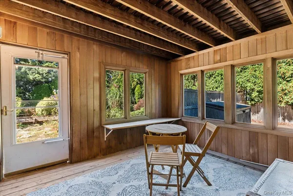 a dining room with furniture and windows