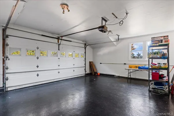 a utility room with wooden floor and furniture