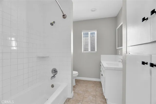 a bathroom with a sink and a window