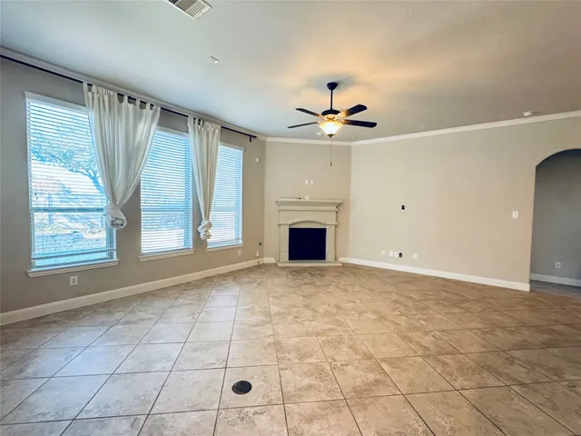 a large kitchen with stainless steel appliances granite countertop a refrigerator and a stove top oven