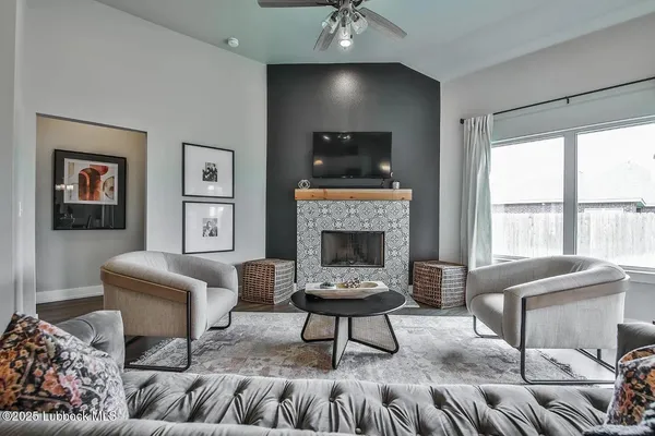 a living room with furniture and a fireplace