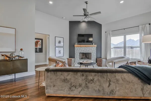 a living room with furniture and a fireplace