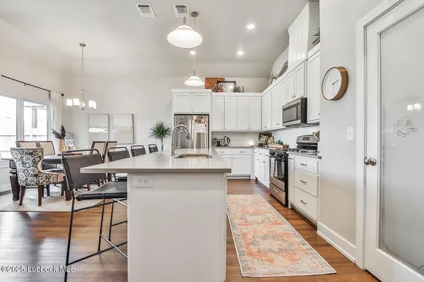 a kitchen with counter space cabinets and appliances