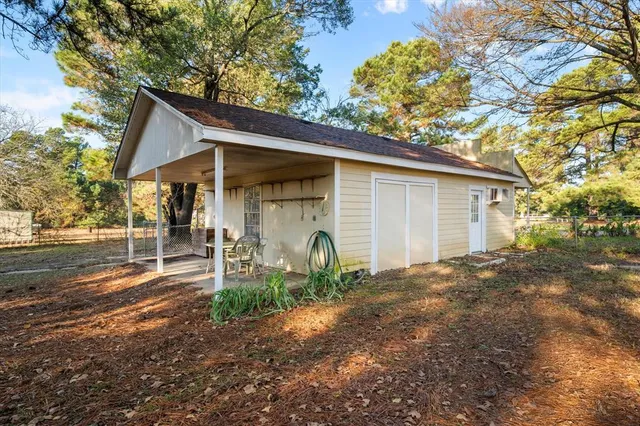 an empty room with closet and mirrors