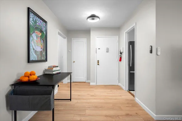 a bedroom with furniture and wooden floor