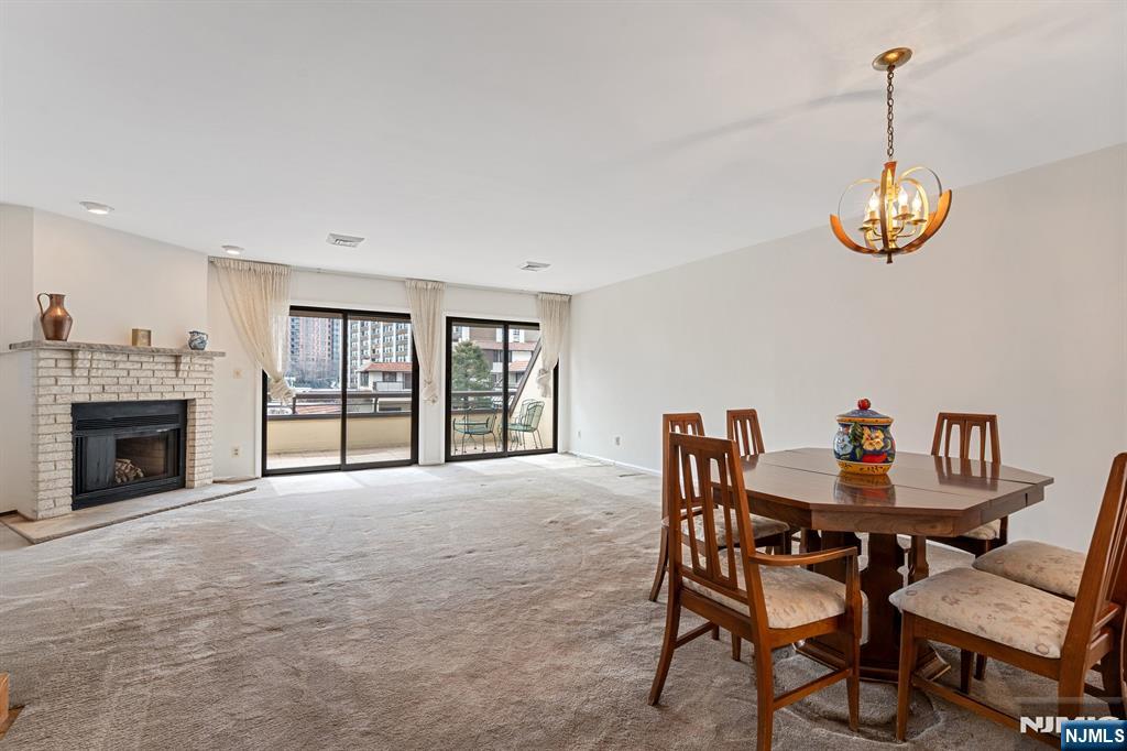 300 Gorge Road, Unit 25 Cliffside Park, NJ 07010 - Photo 13 of 45 a view of a dining room with furniture window and fireplace
