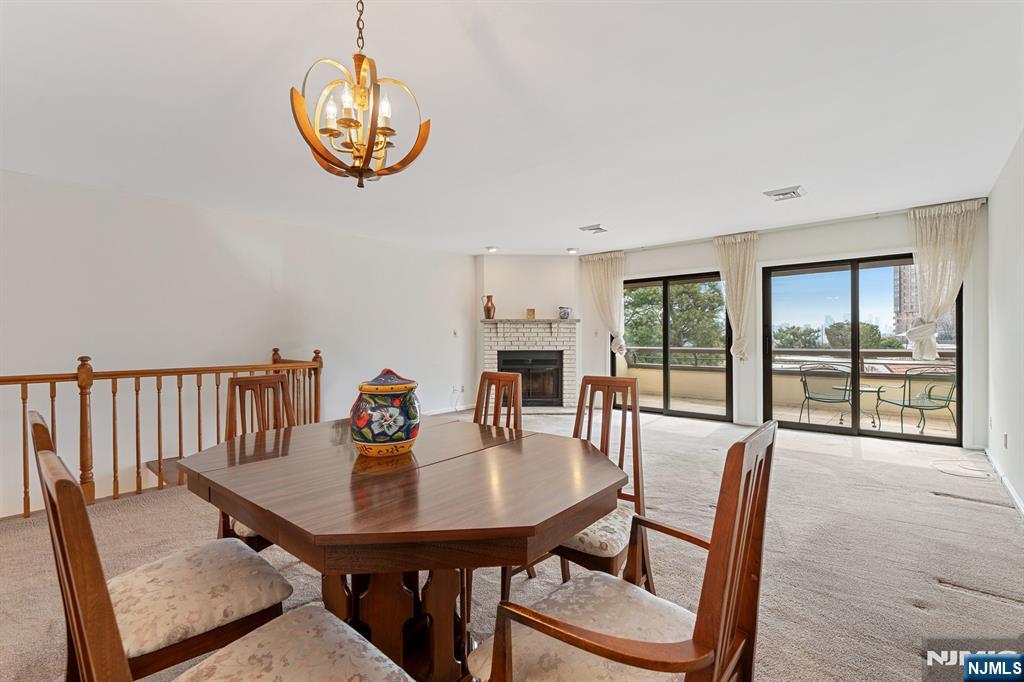300 Gorge Road, Unit 25 Cliffside Park, NJ 07010 - Photo 14 of 45 a view of a dining room with furniture window and outside view