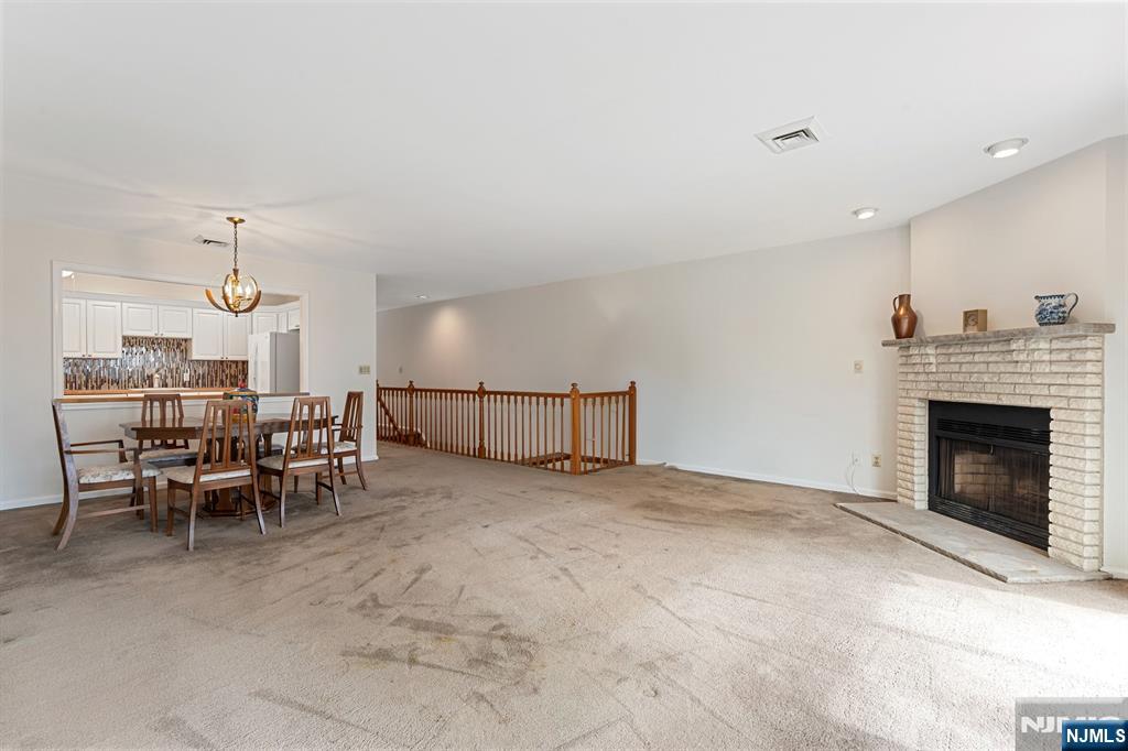 300 Gorge Road, Unit 25 Cliffside Park, NJ 07010 - Photo 16 of 45 a view of a livingroom with furniture and a fireplace
