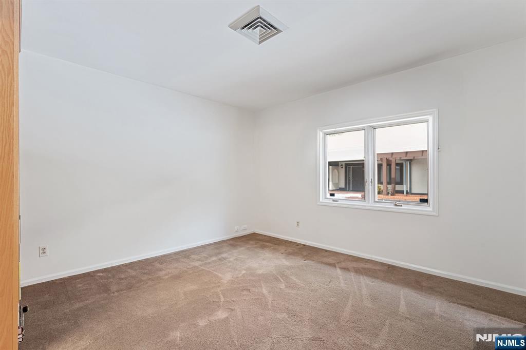 300 Gorge Road, Unit 25 Cliffside Park, NJ 07010 - Photo 18 of 45 a view of an empty room with a window