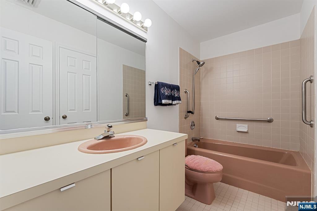 300 Gorge Road, Unit 25 Cliffside Park, NJ 07010 - Photo 21 of 45 a bathroom with a sink a toilet and shower