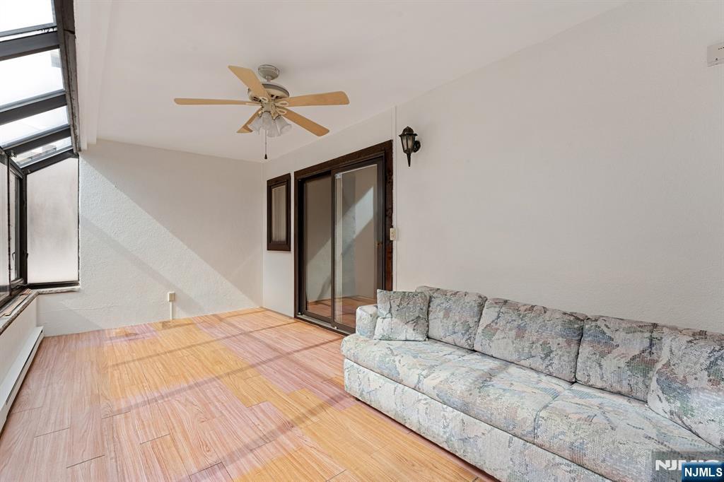 300 Gorge Road, Unit 25 Cliffside Park, NJ 07010 - Photo 23 of 45 a living room with a couch