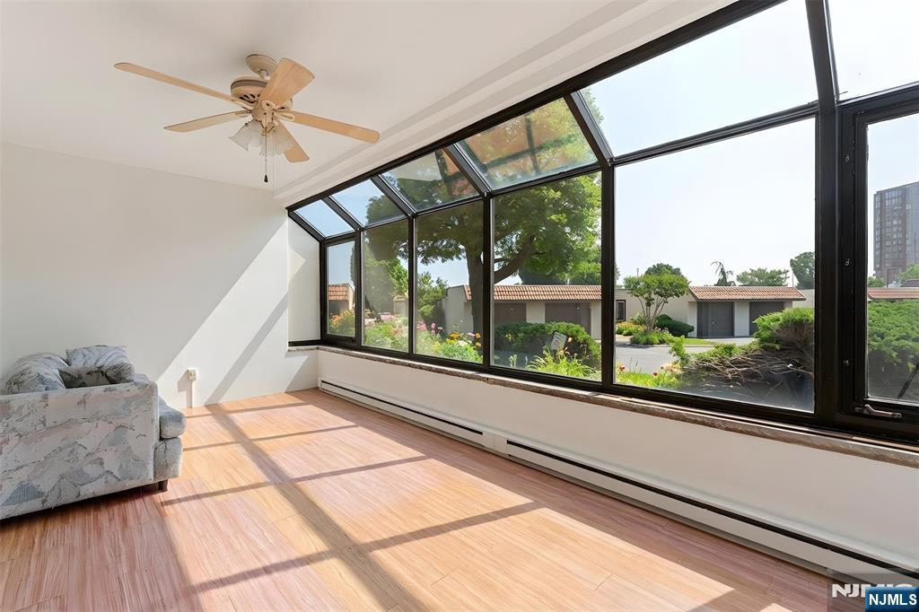 300 Gorge Road, Unit 25 Cliffside Park, NJ 07010 - Photo 26 of 45 a view of a living room and a floor to ceiling window with wooden floor